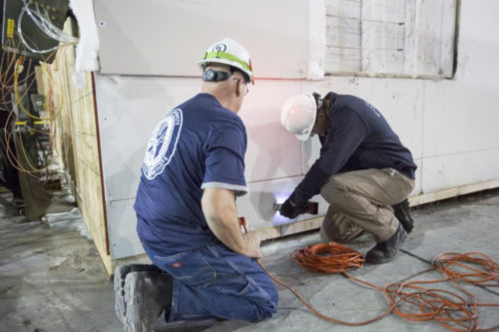 Two representatives setting up training