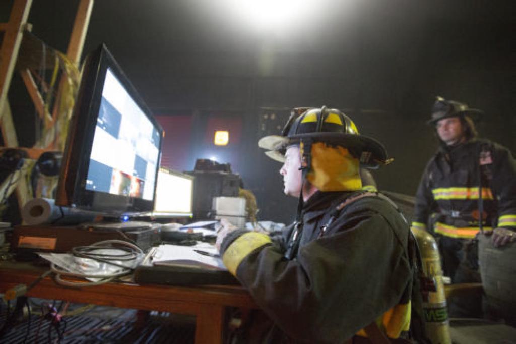 Firefighter training control room two firefighters