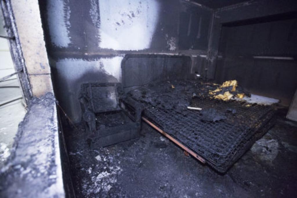 Remining burned furniture inside structure