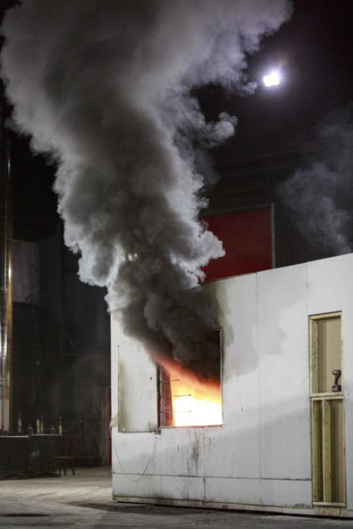 Smoke coming out of concrete training structure window