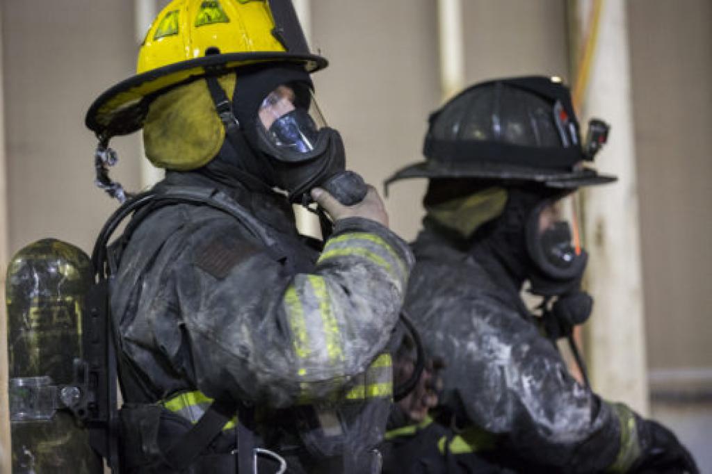 Fire fighters covered in ash after training