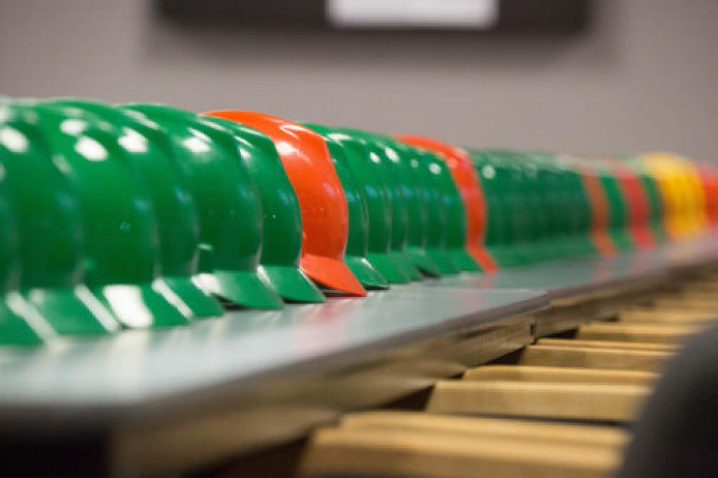 Orange and green safety helmets