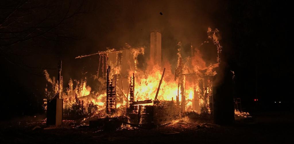 house on fire in the dark