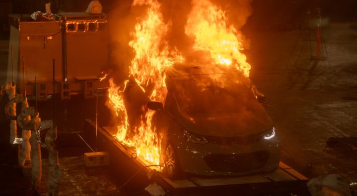 A fully involved vehicle fire captured during a series of EV fire experiments.