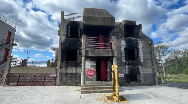Exterior view of the burn building used for firefighting training, where fire experiments were conducted to study fire behavior and thermal conditions