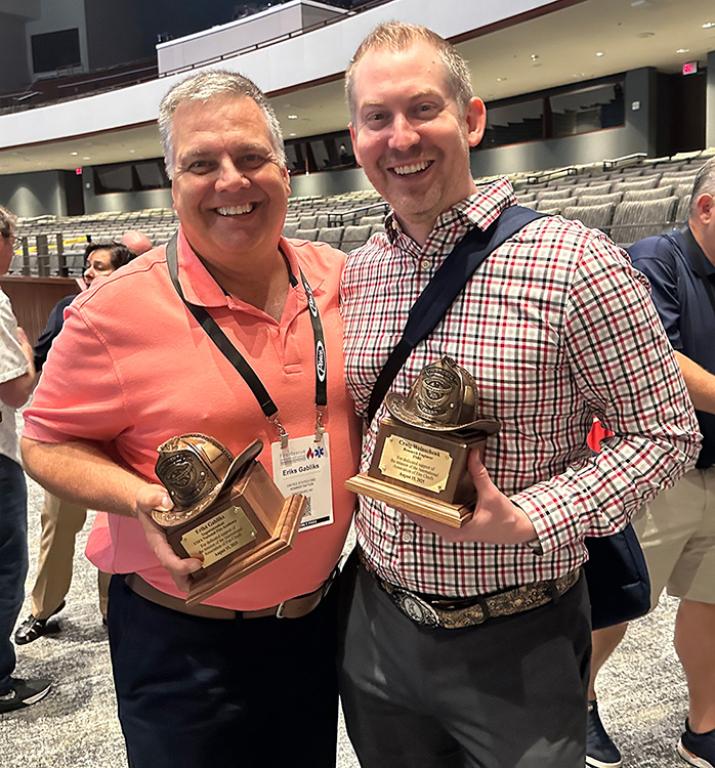 Craig Weinschenk and Eriks Gabliks posing with their awards