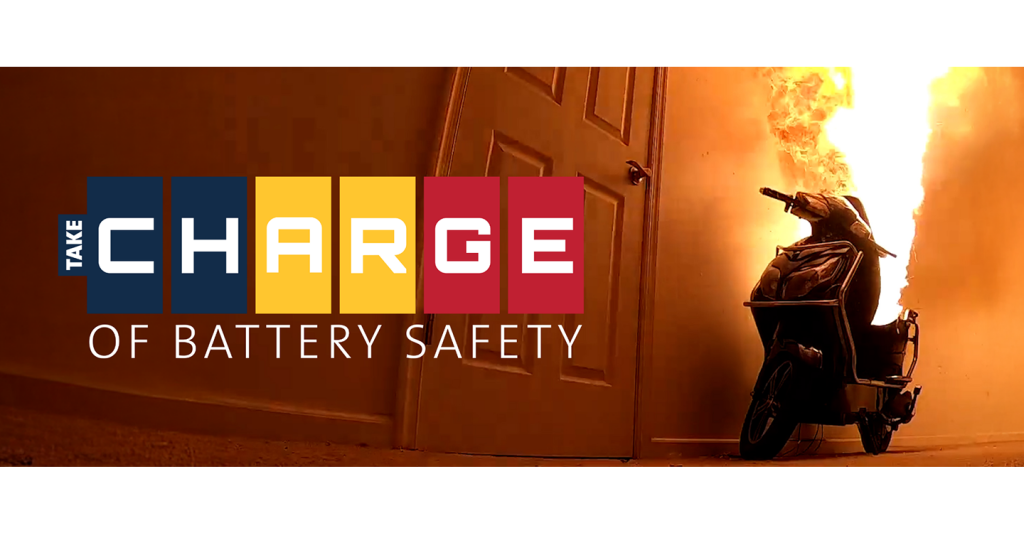 Electric scooter on fire with the "Take C.H.A.R.G.E. of Battery Safety" logo