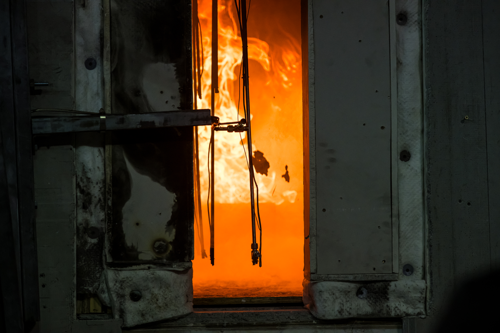 Close-up photograph of the gas burner igniting in the double-room compartment