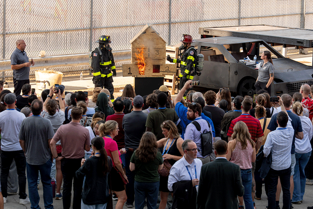 ULRI’s Fire Safety team demonstrating the Hose Stream Mechanics Prop to Research Symposium Attendees