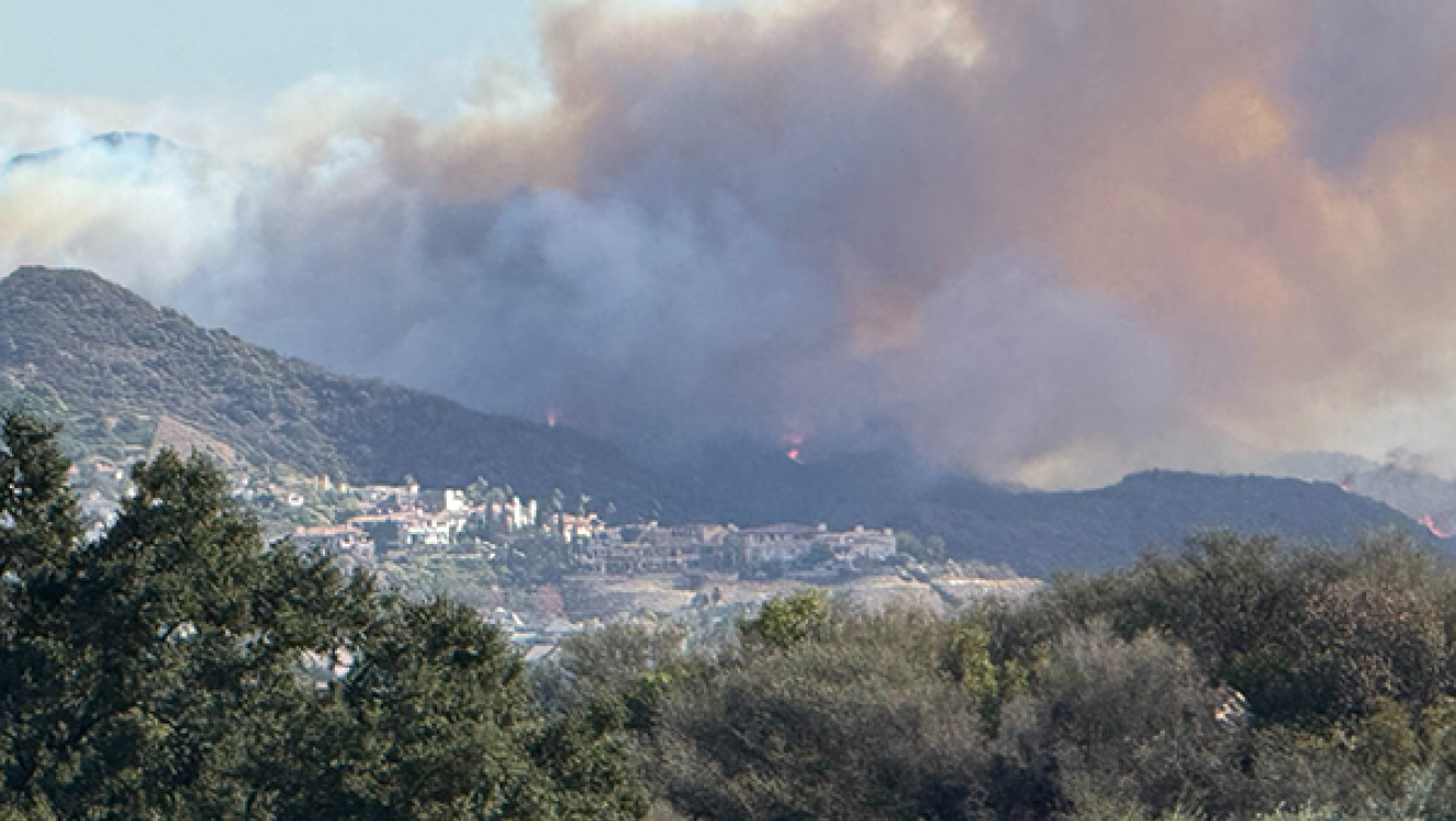 A wind-driven plume of smoke from fire spreading from wildland into the built environment during the Southern California fires in January 2025
