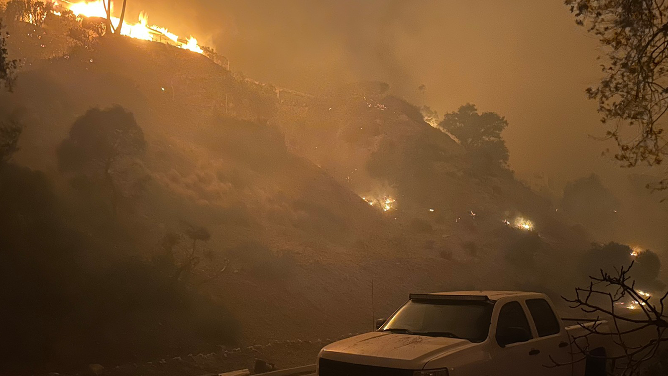 Wildfires approach the built environment, igniting vehicles