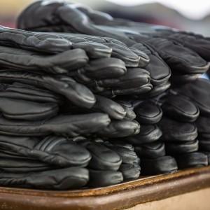 Stack of black firefighting gloves