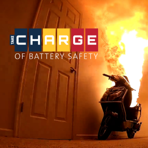 Electric scooter on fire with the Take C.H.A.R.G.E. of Battery Safety logo