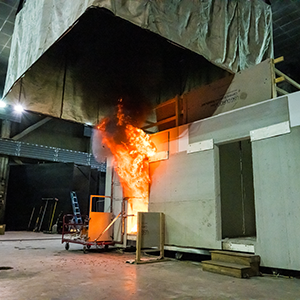 A double-room compartment being utilized in an experiment test where the left room is undergoing flashover